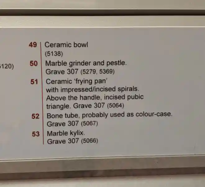 Early Bronze Age ceramic frying pan decorated with impressed spirals and incised pubic triangle from Grave 307, Syros